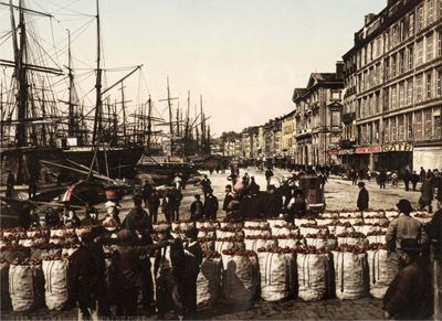 a group of people standing in front of a fence