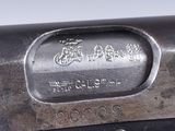 an image of a gun with a metal handle on a white background