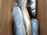 a box full of blue and white shoes in it