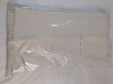 a plastic bag that is sitting on top of a bed