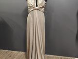 the mannequin is standing in front of a dress on a mannequin stand