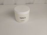 a white container sitting on top of a white table