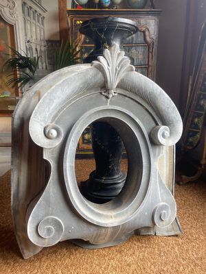 a clock that is sitting on the floor in the living room