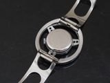a close up of a watch on a black surface