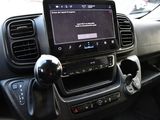 a car dashboard with a tablet on the dashboard