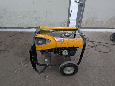a small generator that is sitting on the ground