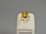 a close up of a ring with a citrine stone in it