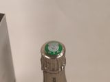 a bottle of champagne sitting on a table next to a box