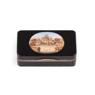 a small black box with a picture of a building on it