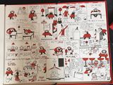 an open book with a picture of santas and other characters on it