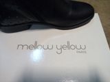 a box with a pair of black shoes on it