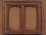 a close up of a wooden frame with a brown background
