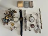 many different types of watches and other items on the table