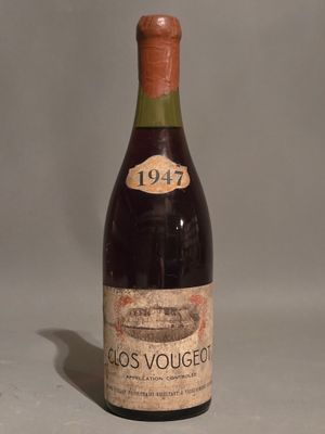 a bottle of wine that is sitting on a table