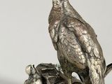 silver plated figurine of a pheasant and chicks