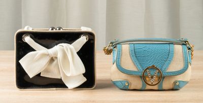 two purses that are sitting on a table
