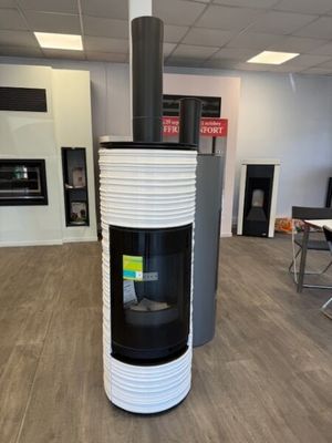 a black and white stove in the middle of a room