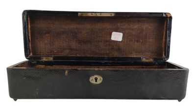 a black suitcase with a key in it on a white background