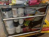 a cart that has many different types of paint on it
