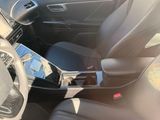 the interior of a car with black leather seats and a steering wheel