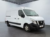 the white van is parked in a large room with a gray floor