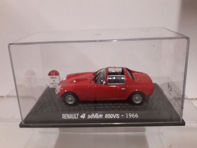 a red car in a clear case on a table