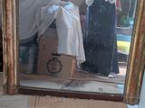 a mirror that has a picture of a woman in it