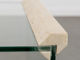 a close up of a glass table with a piece of wood sticking out of it