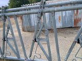 a fence that has a bunch of metal bars attached to it