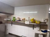 a kitchen with a lot of items on the counter