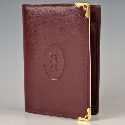 a close up of a wallet with a penguin on it