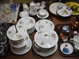 a lot of dishes and cups on the table