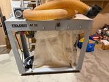 a machine that has a blower attached to it ' s side