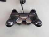 a video game controller that is plugged into a wall