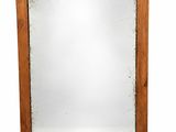 an image of a mirror with a wooden frame on a white background