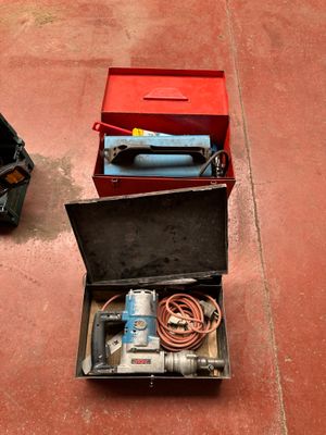 two tools in a case on the ground