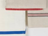 three napkins with red, white, and blue stripes on them