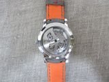 a close up of a watch on a cloth