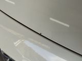 a close up of a car ' s front bumper with a sticker on it