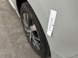 a sticker on the side of a car with a sticker on it