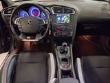 the interior of a car with a steering wheel, dashboard, and dashboard lights