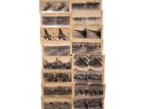 many old photographs of military men on the wall