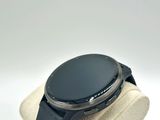 a smart watch sitting on top of a watch stand