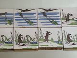 six tiles with animals and birds on them on a table