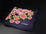 a close up of a black and pink scarf with gold and pink flowers