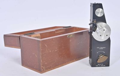 a small wooden box with a clock on top of it