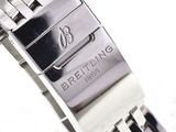 a close up of a watch on a white surface