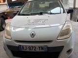 a white car parked in a garage with a sign on the front of it