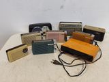 a lot of old radio ' s on a table