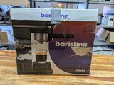 a box with a coffee machine on a table
